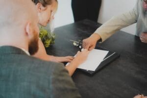 couple signing a mortgage contract